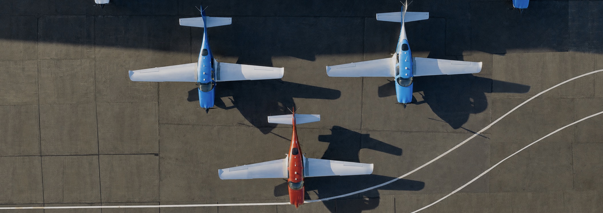 Cirrus aircraft parked on the ramp, photographed from directly above