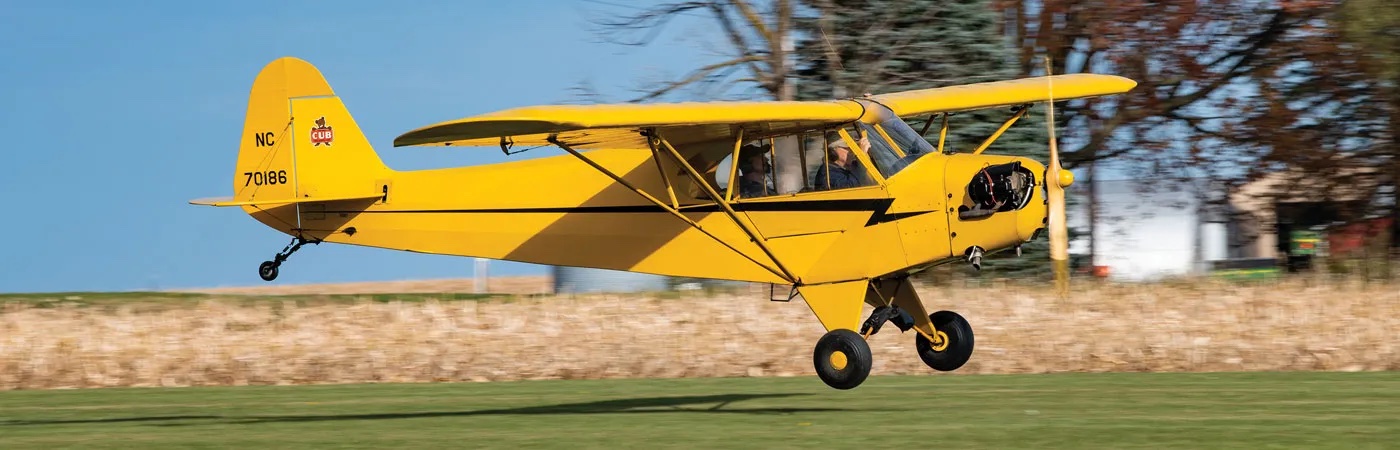 Piper Cub on the grass, tailwheel down